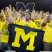 Michigan senior Steve Benavids, of Troy, sticks his tongue out while dancing in the stands before the start of a taping of ESPN's College Game Day at Crisler Arena on Saturday morning. Melanie Maxwell I AnnArbor.com